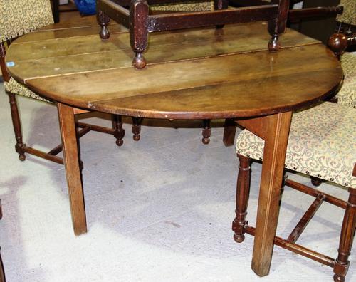A large 19th century oak drop flap dining table.