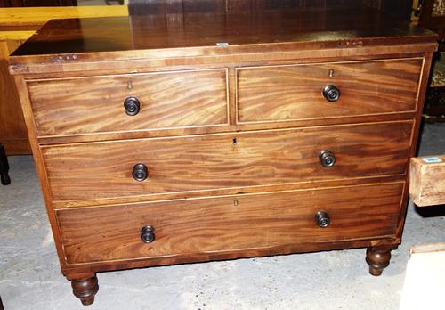 A mahogany chest of two short and two long drawers.