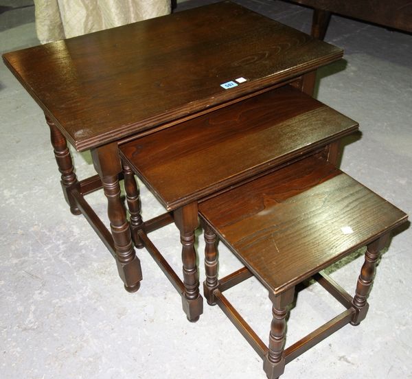 A nest of three 20th century oak side tables. (3)
