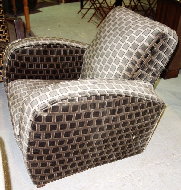 An Art Deco style upholstered armchair.