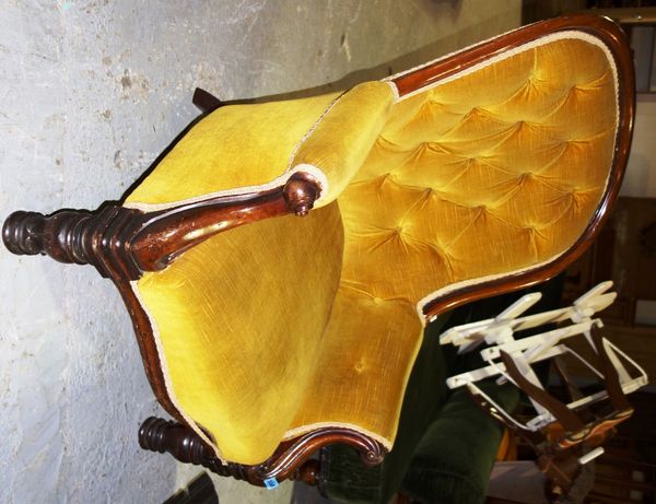A 19th century upholstered spoon back nursing chair.
