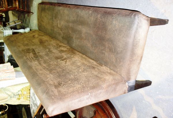 A 20th century brown leather three seat sofa bench.