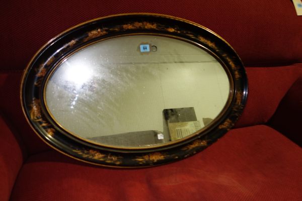 An oval chinoiserie decorated wall mirror.