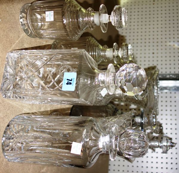 A quantity of assorted cut glass including decanters, lamp bases, vases and sundry.