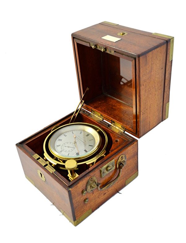 An early 19th century mahogany cased marine chronometer by Reid & Sons, Newcastle-upon-Tyne, with subsidiary seconds hand against a silvered dial plat