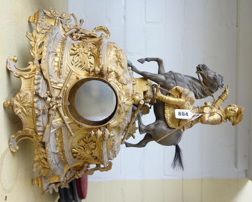 A Continental gilt bronze cased mantel clock, late 19th century, the surmount cast with a Civil War soldier on horseback, with cannon beneath, on an o