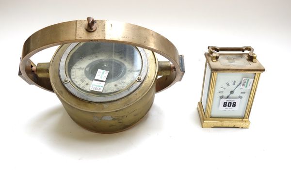 A brass cased carriage clock by Mappin & Webb, and a brass naval gimbal mounted compass (a.f), 16.5cm diameter. (2)