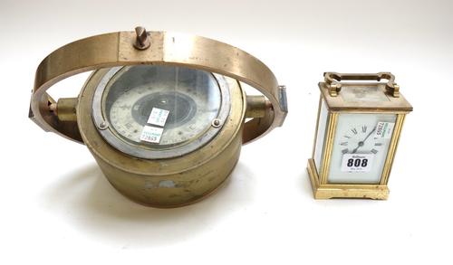 A brass cased carriage clock by Mappin & Webb, and a brass naval gimbal mounted compass (a.f), 16.5cm diameter. (2)