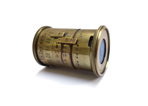 A Watkins brass photographic exposure meter, 5cm.