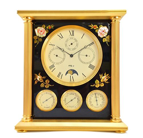 A Swiss Imhof clock/weather station, multi dial, with pillar supports and lacquered sides, 23cm high.  Illustrated