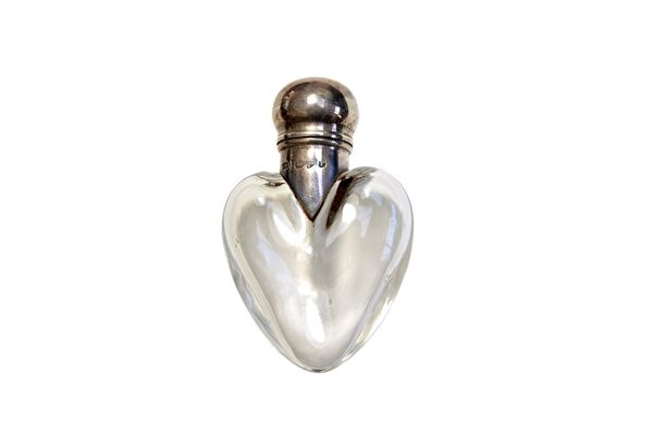 A glass and silver mounted scent bottle, hallmarked Chester 1898, maker's mark for George Watts & Co., heart shaped with hinged silver mounts, 6.5cm.