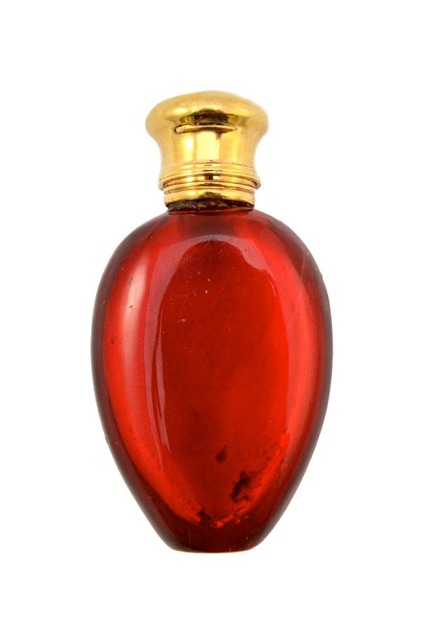 A red glass and gilt metal mounted scent bottle, late 19th/early 20th century, with ovoid body and monogrammed hinged lid (no visible identifying hall