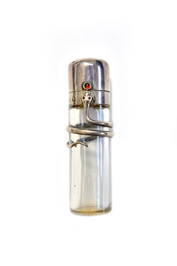 A glass and silver mounted scent bottle, hallmarked Birmingham 1896, the cylindrical glass body with applied trailing snake, with inset red glass eyes