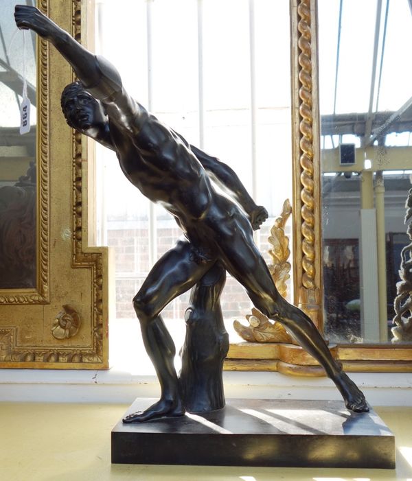After the antique; a late 19th century bronze figure modelled and cast as a Romanesque male nude, on a rectangular plinth base, 52cm high.