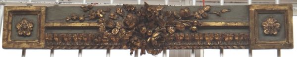 A painted and giltwood overdoor mantel, 19th century, carved and moulded with flowers and bows, 106.5cm wide.
