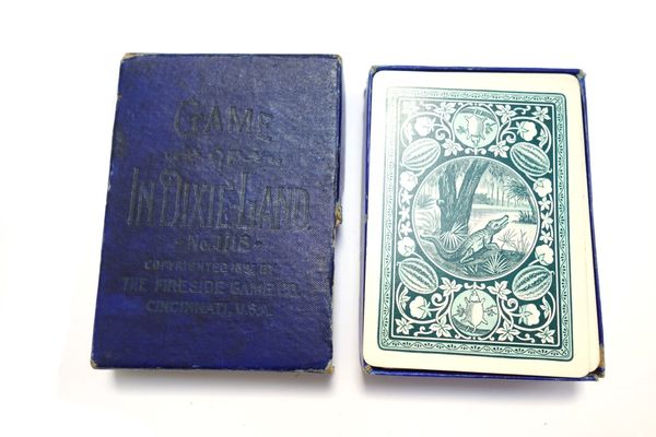 A pack of playing cards by The Fireside Gaming Co., 'In Dixie-Land', copyright 1897; fifty two black and white picture cards depicting black Americans