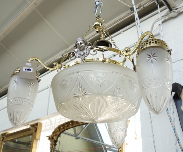 An Edwardian brass and cut glass dish light with cut glass bowl surrounded by three shaped shades, 56cm high.