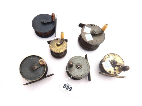 A Chas Farlow two inch brass fishing reel, late 19th century, together with another small brass 2.25 inch reel detailed 'G. Little', and four further