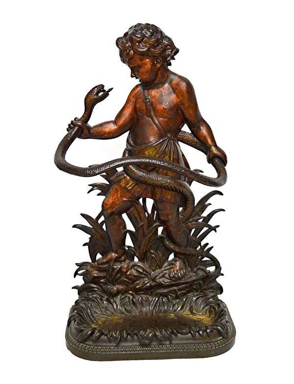 A Coalbrookdale cast iron stick stand, mid-19th century, modelled and cast with the infant Hercules wrestling a snake, with foliate cast drip pan (a.f