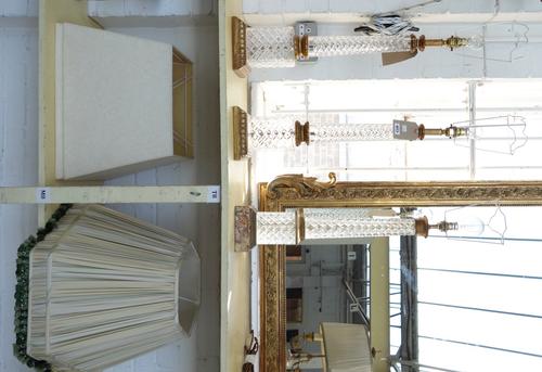 A pair of cut crystal table lamps, late 20th century, with a cylindrical column over a square base and giltwood plinth, 60cm high excluding fitments,