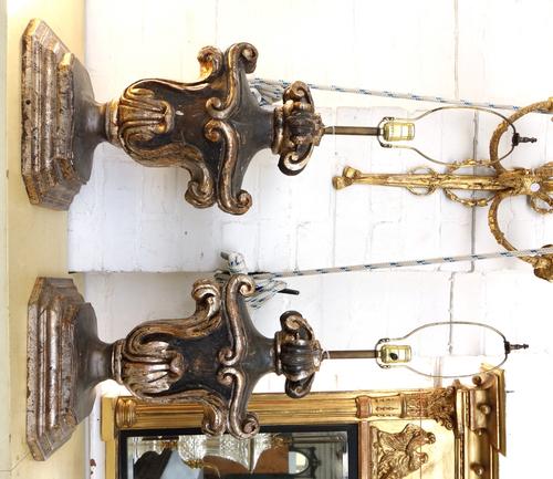 A collection of lighting, comprising; a pair of parcel gilt wooden scroll table lamps, 50cm high, an alabaster column lamp, 113cm high, and three glas