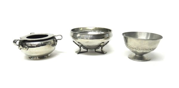 Three Tudric pewter footed bowls, circa 1900, comprising; a round shaped tri-handled bowl, 13cm diameter, a bowl decorated with geometric band motif t