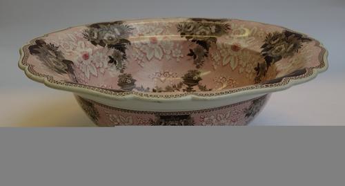 A pair of Liberty & Co pewter candlesticks, each with relief cast foliate stem and domed foot, numbered 0230, 12.5cm high. (2)