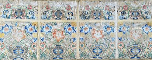 A silk and metal thread embroidered altar panel, 18th century, each panel with a vase filled with naturalistic flowers, insects and pairs of green par