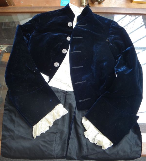 A three piece velvet suit, circa 1911, with interior retailers label for J. Dege & Sons, 13 Conduit St, London, paste set buttons, frilled cuffs and b
