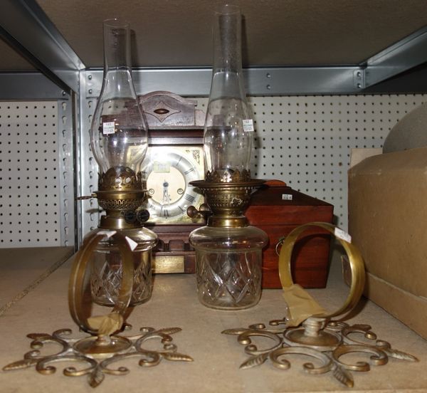 An oak cased eight day mantel clock, a pair of wall mounted oil lamps and a mahogany tea caddy (4). S2T