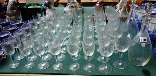 A part suite of 20th century stemware, each bowl with foliate acid etched decoration, with a tapering stem and circular foot, comprising; three decant