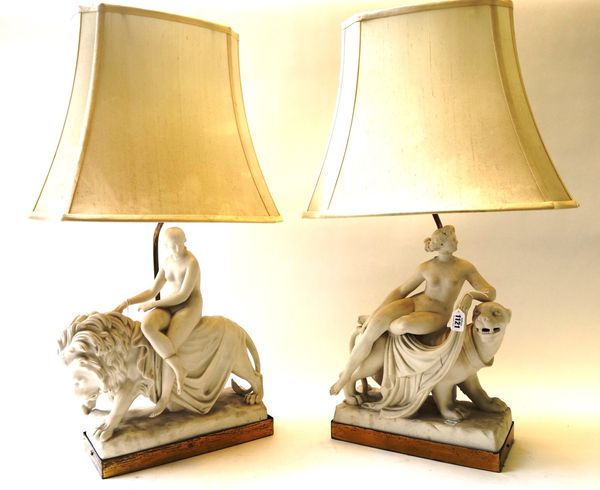 A pair of Minton parian ware figure groups, 19th century; 'Una and the Lion' and 'Ariadne and the Panther', modelled by John Bell, each mounted as a t