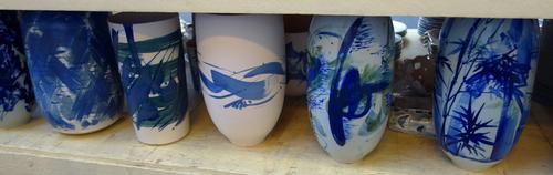 Li Xanghan, 20th century, a group of porcelain vases and sculptures, mainly decorated blue abstract against a white ground. Tallest vase 41cm h. (a.f.