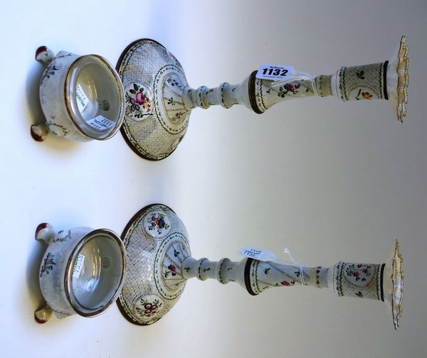 A pair of mid 18th century Bilston enamel type candlesticks, each gilt foliate decorated on a domed foot, 25cm high, and a pair of 18th century enamel