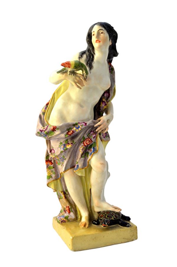 A Meissen porcelain figure emblematic of 'Touch', mid 18th century, modelled as a partially naked young woman with a parrot biting her right index fin