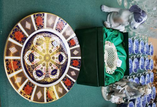 A Royal Copenhagen porcelain puppy dog, no.051, 19.5cm high, a Lladro figure of a young girl and her doll, a Royal Crown Derby Imari plate, and a mode