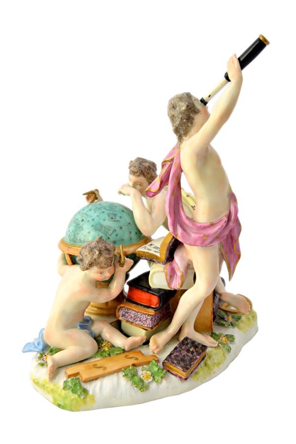 A Meissen group emblematic of astronomy, mid 18th century, blue crossed sword mark, modelled with two youths and a putto seated and standing by a cele