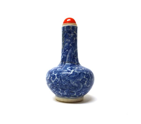 A small Chinese blue and white snuff bottle, 19th century, of bottle form, painted with a dragon amongst flowering peony, painted Yongzheng four chara