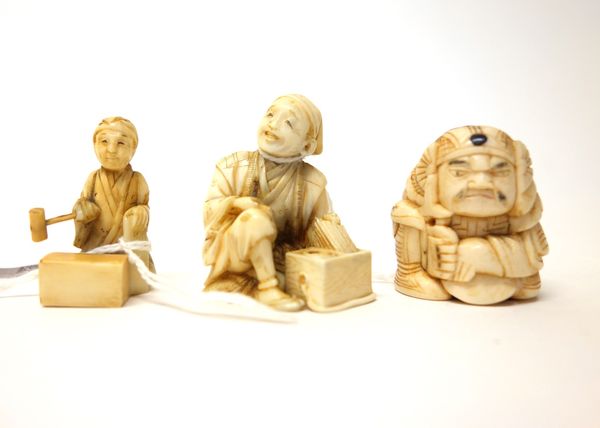 A Japanese ivory okimono of a tradesman, Meiji period, carved carved with his wares in front, signed on red reserve, (a.f), 4.5cm. high; also a small