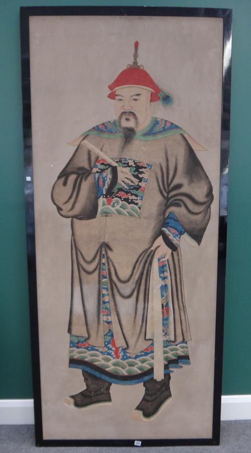A large Chinese full-length portrait of an official, 19th/20th century, ink and colour on paper, 205cm. by 86cm., framed
