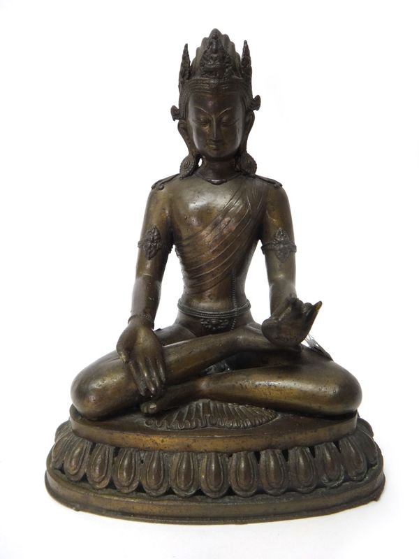 An Asian bronze figure of Tara, 20th century, seated crossed legged on a lotus base, 30cm. high.
