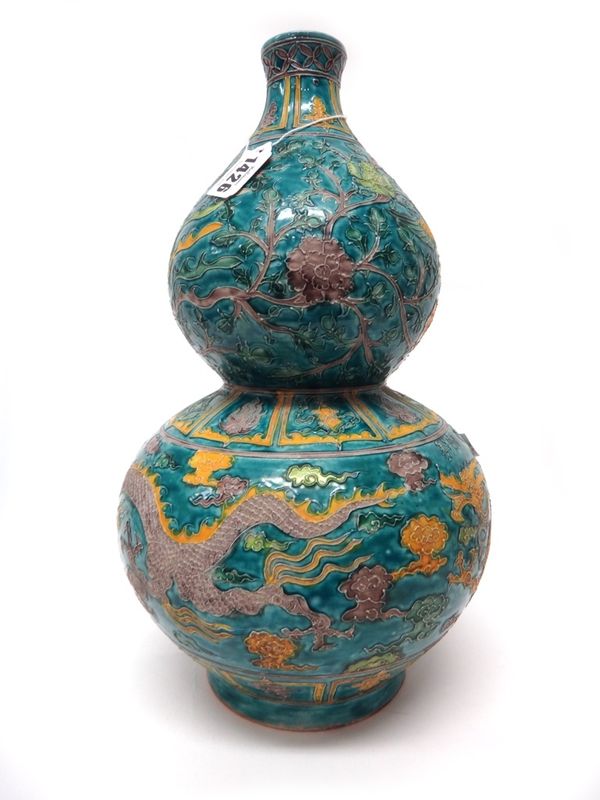 A Chinese fahua-style double gourd vase, 20th century, decorated with dragons amongst cloud scrolls and phoenix flying amongst flowering branches, aga