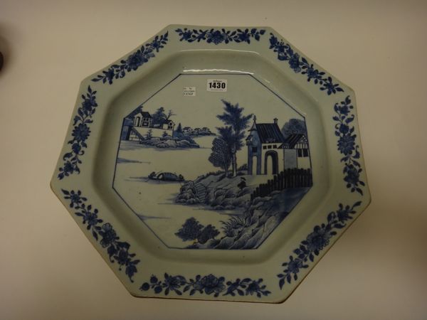 A Chinese export  porcelain blue and white octagonal deep dish, Qianlong, painted with a central river landscape beneath a border spaced with flower s