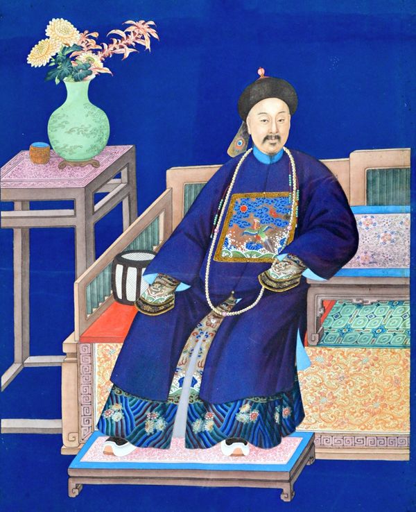 A pair of Chinese paintings of a man and woman, late 19th/early 20th, gouache on paper, each seated in official robes beside a vase of flowers against