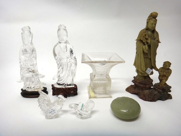 A group of Chinese works of art, Qing Dynasty, comprising; two rock crystal figures of Guanyin, tallest 20cm. high, wood stands; two rock crystal mode