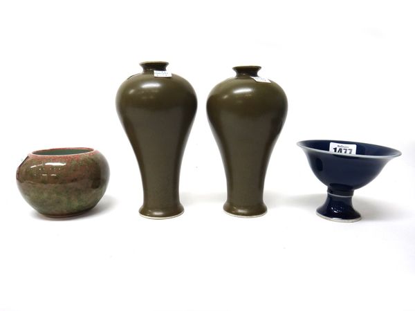 A Chinese porcelain blue ground stem cup, Jiajing mark but later, 7.75cm.high; also a peachbloom brush washer, 8cm.high, and a small pair of `teadust'