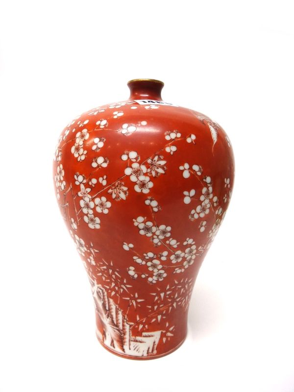A Chinese porcelain baluster vase, iron-red Jiaqing seal mark but later, painted with birds in branches of flowering peony against a rouge-de-fer grou