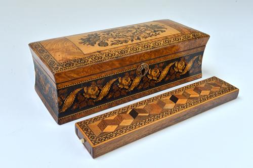 A 19th century Tunbridge ware glove box of sarcophagus form, 25cm wide, together with a Tunbridge ware deceptive cube inlaid pin box, 24cm wide (2). I