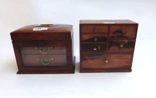An early 20th century walnut jewellery box, the lid revealing a fitted interior over a glazed drop front enclosing drawers, 23cm wide, together with a
