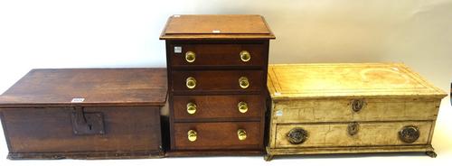 An 18th century pine rectangular trunk, 49cm wide, a small oak bank of four graduated drawers, 31cm wide and a white painted oak box with lift top ove